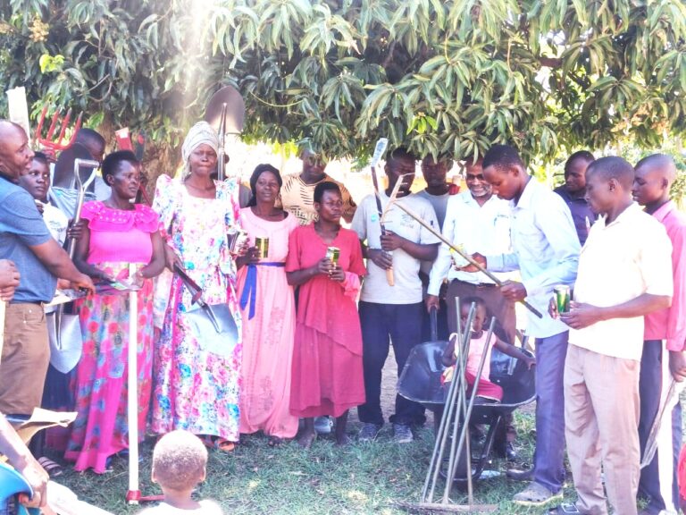 CVCs of Kyangundu Community in Nkondo Sub County receiving items from CHAIN Uganda Directors