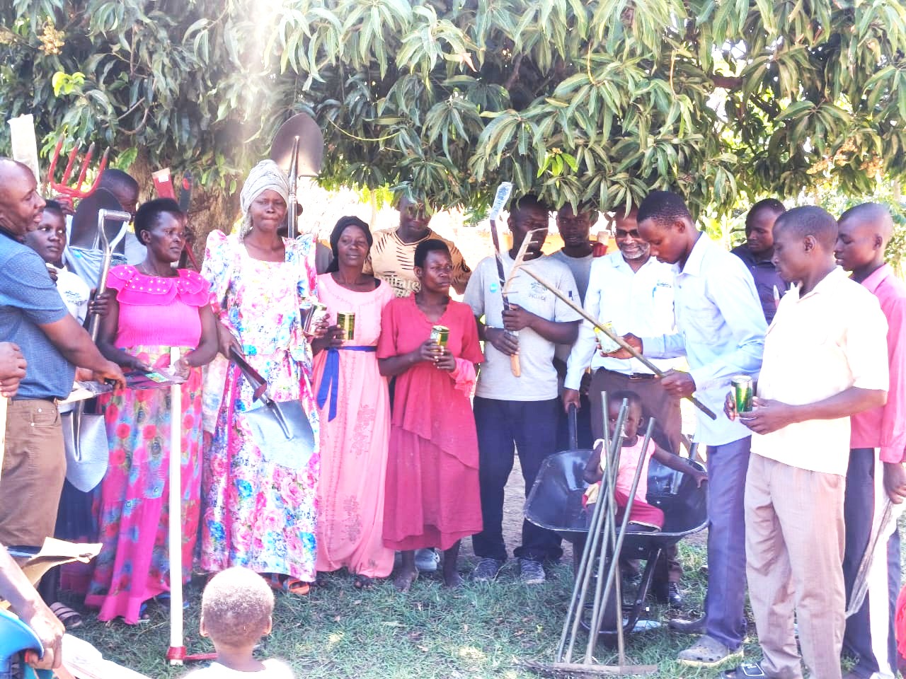 CVCs of Kyangundu Community in Nkondo Sub County receiving items from CHAIN Uganda Directors